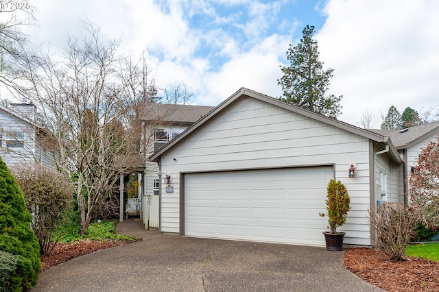 exterior space featuring a garage and driveway