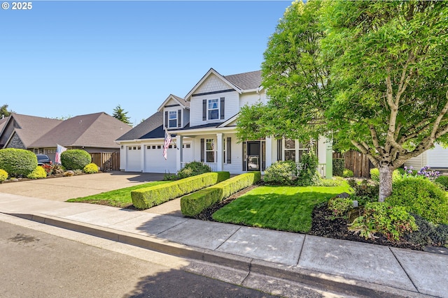 view of front of home with driveway, an attached garage, covered porch, and a shingled roof