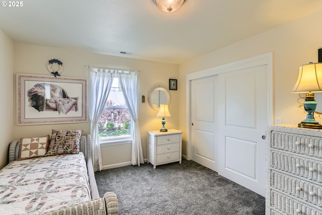 carpeted bedroom featuring a closet