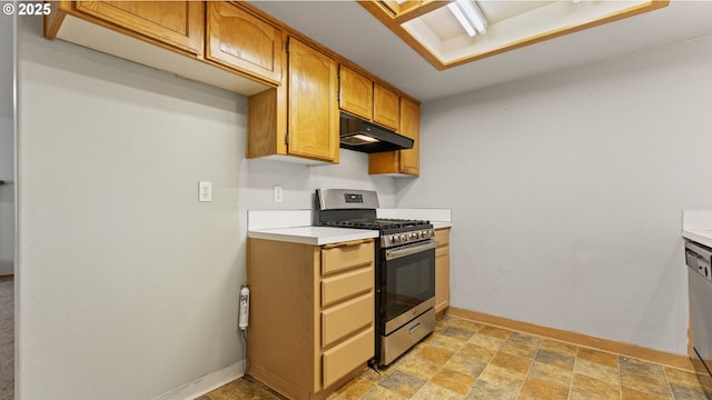 kitchen featuring stainless steel gas stove, under cabinet range hood, light countertops, and baseboards