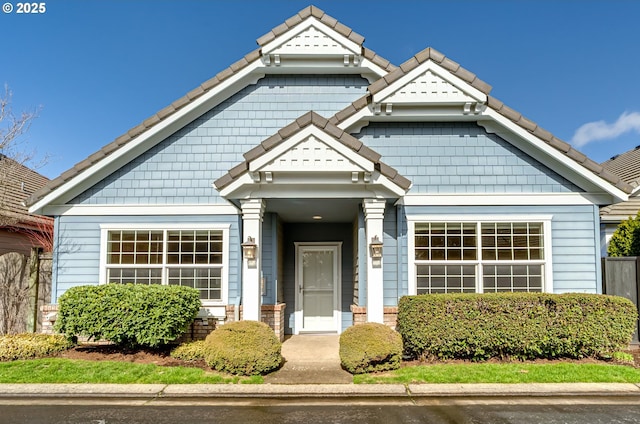 view of front of home featuring a tile roof