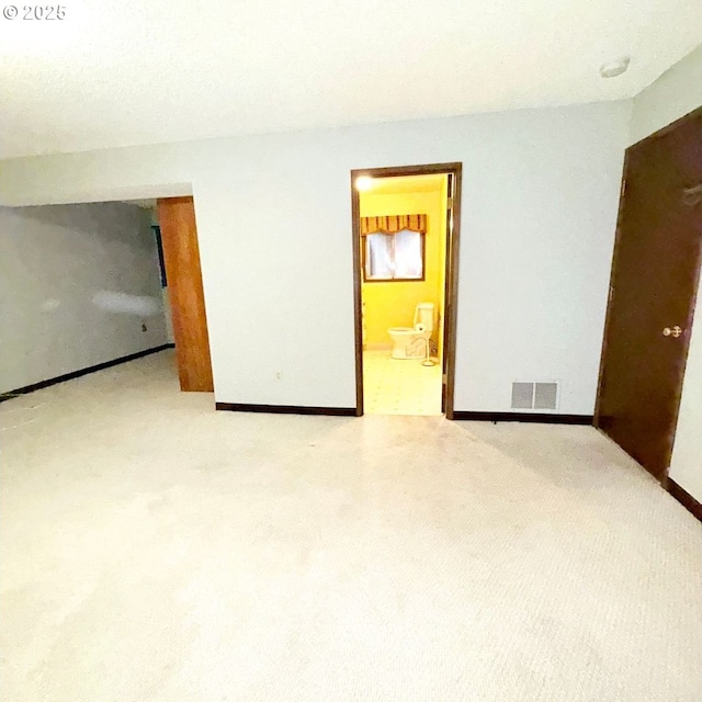 14807 NE Siskiyou Ct, Portland, OR 97230 - unfurnished bedroom featuring baseboards and ensuite bath