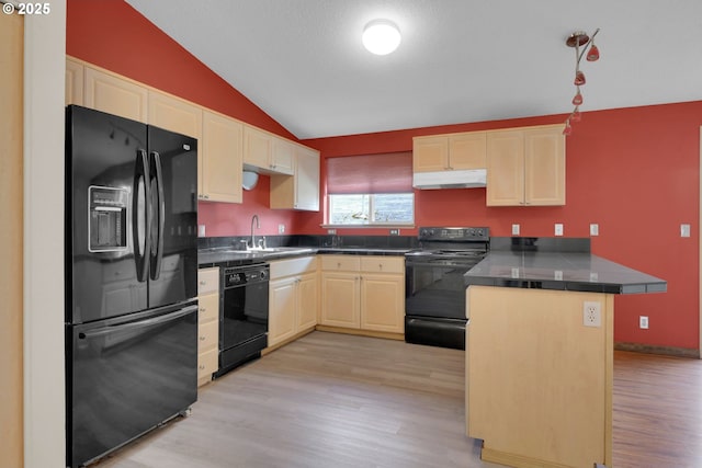 815 Bobolink Ave, Eugene, OR 97404 - kitchen with black appliances, under cabinet range hood, a peninsula, a sink, and vaulted ceiling