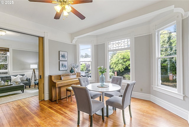 2153 NE Rodney Ave, Portland, OR 97212 - dining area with healthy amount of natural light, a ceiling fan, and light wood-style floors