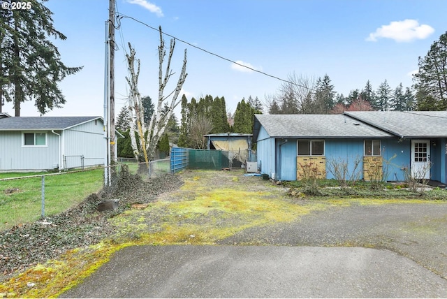 view of home's exterior with fence