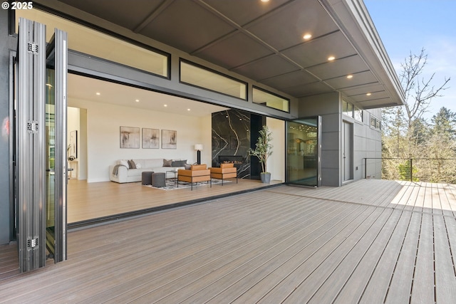 wooden deck featuring an outdoor hangout area