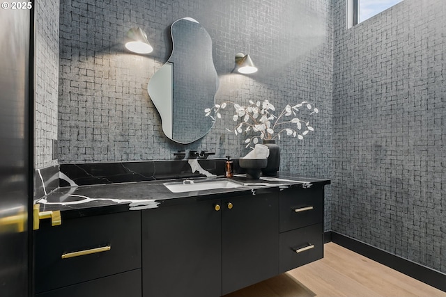 bathroom featuring vanity and hardwood / wood-style flooring