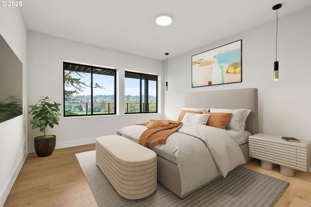 bedroom with light hardwood / wood-style floors