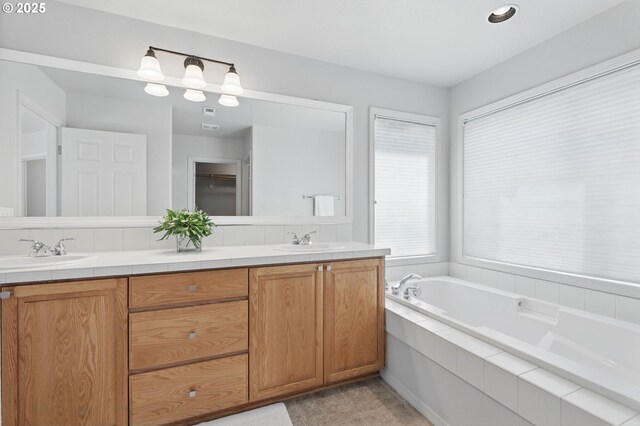 2510 NW Rogue Valley Ter, Beaverton, OR 97006 - full bathroom featuring double vanity and a garden tub