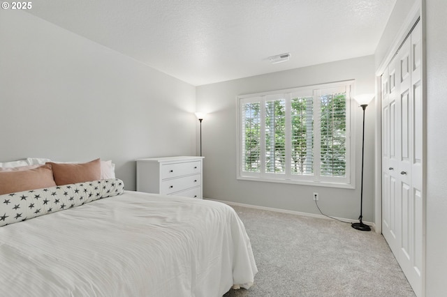2510 NW Rogue Valley Ter, Beaverton, OR 97006 - carpeted bedroom with baseboards and a closet
