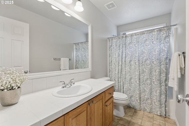 2510 NW Rogue Valley Ter, Beaverton, OR 97006 - bathroom with toilet, vanity, backsplash, and curtained shower