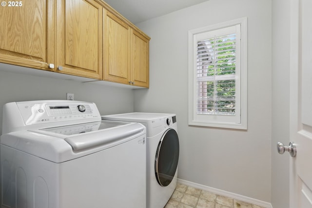 2510 NW Rogue Valley Ter, Beaverton, OR 97006 - laundry area featuring washer and dryer, cabinet space, and baseboards