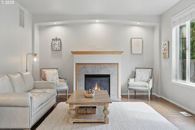2510 NW Rogue Valley Ter, Beaverton, OR 97006 - living room with recessed lighting, wood finished floors, baseboards, and a tile fireplace