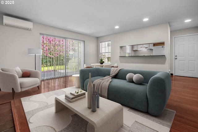 8540 SW Curry Dr Unit D, Wilsonville, OR 97070 - living room featuring a wall mounted air conditioner, wood finished floors, and recessed lighting
