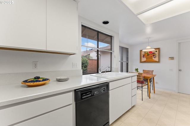 kitchen with black dishwasher, sink, white cabinets, and decorative light fixtures