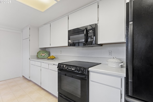 kitchen with white cabinets and black appliances