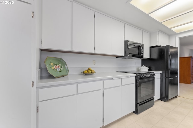 kitchen with black appliances and white cabinets