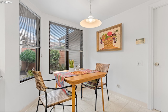 dining room with light tile patterned flooring