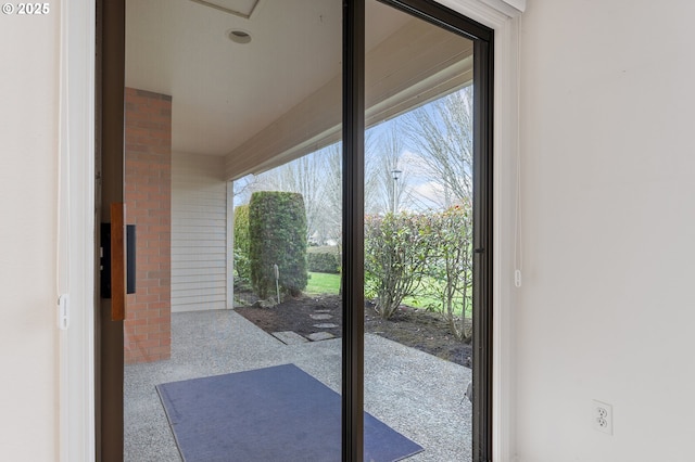 entryway with brick wall