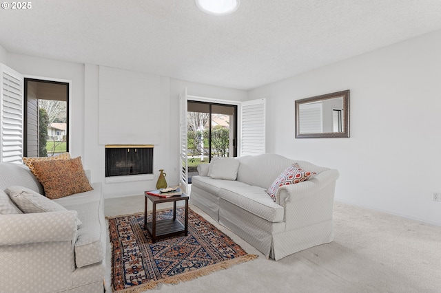 living room with carpet flooring and a textured ceiling