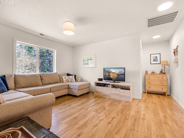 92041 Carmen Creek Rd, Astoria, OR 97103 - living area featuring light wood-style floors and baseboards