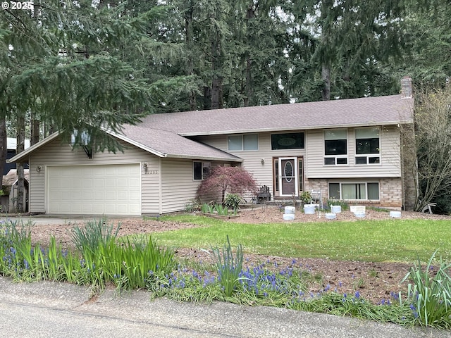 raised ranch featuring a front lawn, a shingled roof, and a chimney