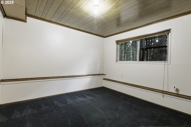 carpeted empty room with wooden ceiling and ornamental molding
