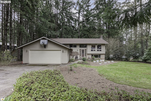 view of front of home featuring driveway, a chimney, an attached garage, and a front lawn