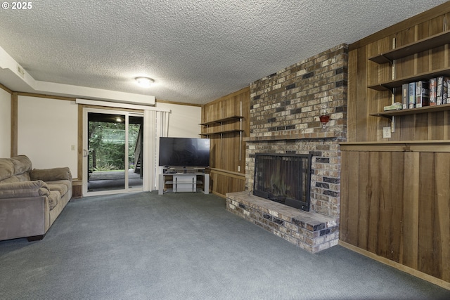 living room with a fireplace, wooden walls, a textured ceiling, and carpet floors