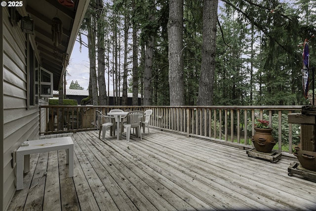 deck featuring outdoor dining area