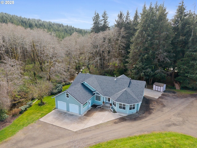 drone / aerial view with a forest view