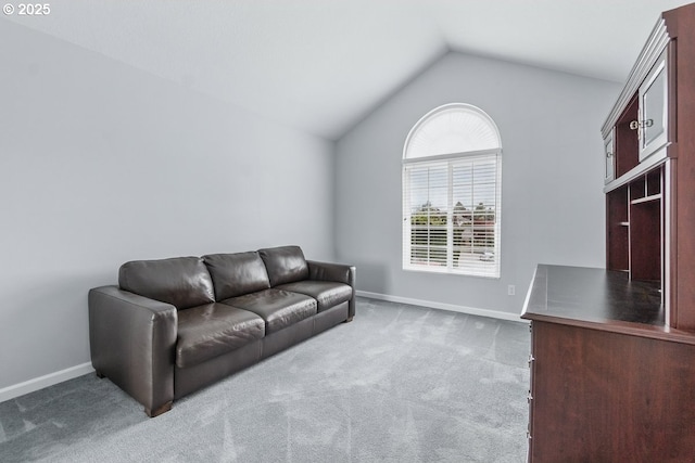 16485 SW Viking Ct, Beaverton, OR 97007 - carpeted living area with lofted ceiling and baseboards