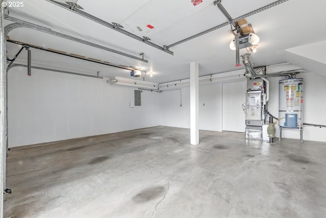 16485 SW Viking Ct, Beaverton, OR 97007 - garage featuring a garage door opener, gas water heater, electric panel, and heating unit