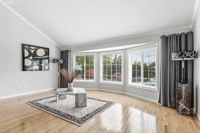 16485 SW Viking Ct, Beaverton, OR 97007 - living area with vaulted ceiling, wood finished floors, plenty of natural light, crown molding, and baseboards