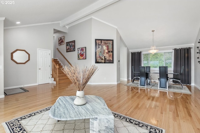 16485 SW Viking Ct, Beaverton, OR 97007 - living room with vaulted ceiling, baseboards, wood finished floors, stairs, and crown molding
