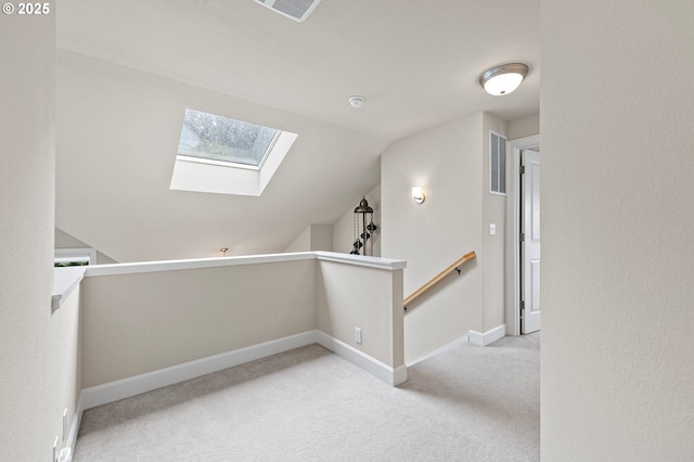3335 Bentley Ave, Eugene, OR 97405 - corridor featuring a skylight, carpet floors, lofted ceiling, and an upstairs landing