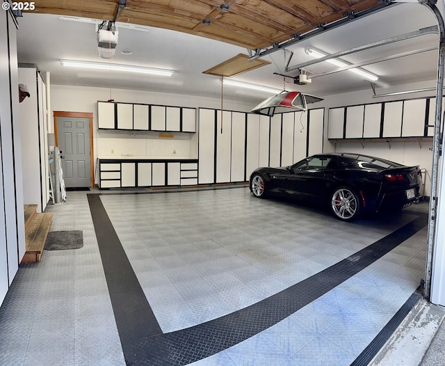 1635 SW 14th St, Warrenton, OR 97146 - garage featuring a garage door opener