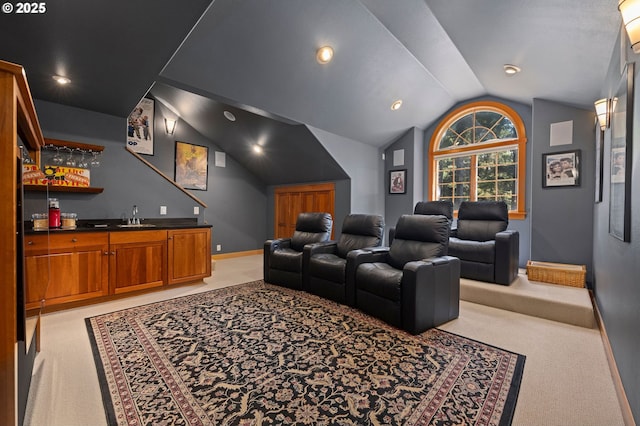 1635 SW 14th St, Warrenton, OR 97146 - cinema featuring light colored carpet, bar with sink, vaulted ceiling, and baseboards