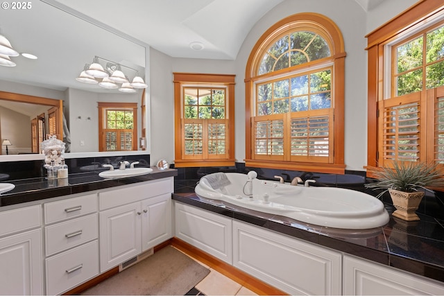 1635 SW 14th St, Warrenton, OR 97146 - full bath with vanity, a bath, and lofted ceiling