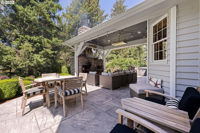 1635 SW 14th St, Warrenton, OR 97146 - view of patio with an outdoor living space with a fireplace and outdoor dining area