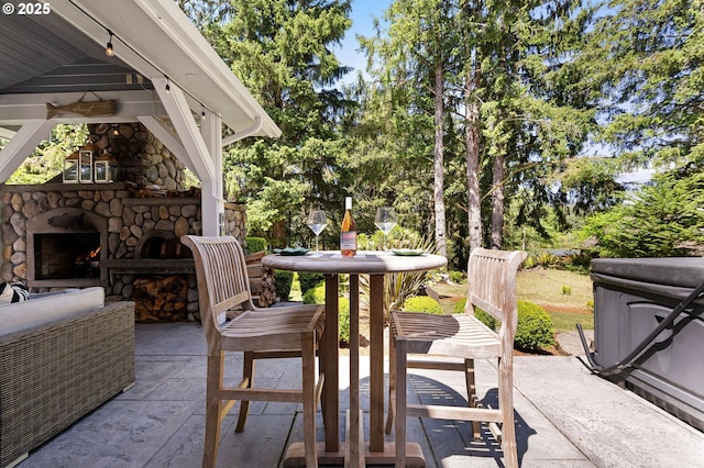 1635 SW 14th St, Warrenton, OR 97146 - view of patio / terrace featuring an outdoor stone fireplace