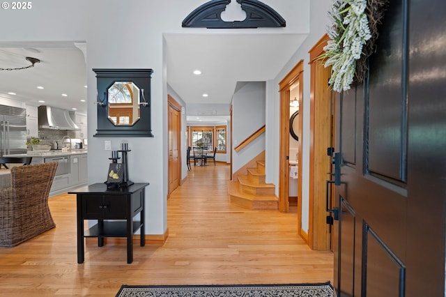 1635 SW 14th St, Warrenton, OR 97146 - foyer entrance featuring stairs, light wood-style flooring, recessed lighting, and baseboards