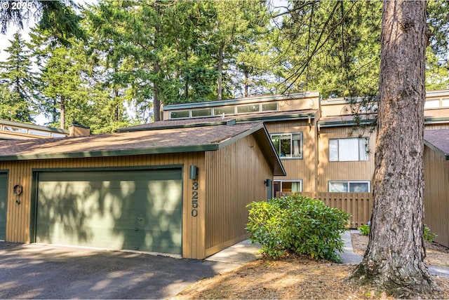 3250 SE 153rd Ave, Portland, OR 97236 - view of front of property with driveway and roof with shingles