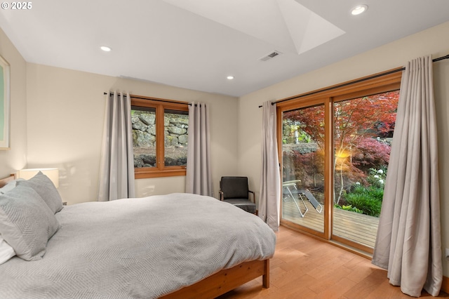 1524 Sherman Ave, Hood River, OR 97031 - bedroom featuring access to exterior, light wood-style flooring, multiple windows, a skylight, and recessed lighting