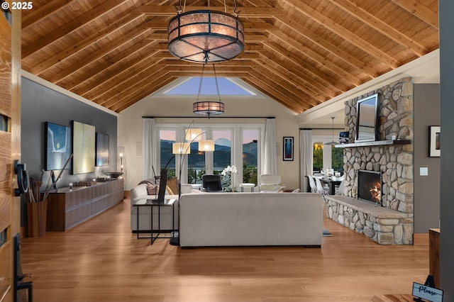 1524 Sherman Ave, Hood River, OR 97031 - living area featuring a fireplace, wooden ceiling with exposed beams, wood finished floors, high vaulted ceiling, and a chandelier