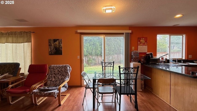 2113 SE 181st Ave, Vancouver, WA 98683 - dining area featuring light wood finished floors, a textured ceiling, and recessed lighting