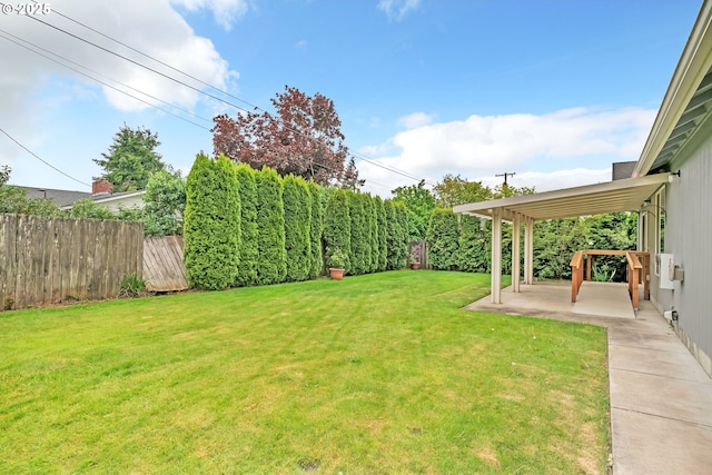 view of yard featuring fence and a patio area