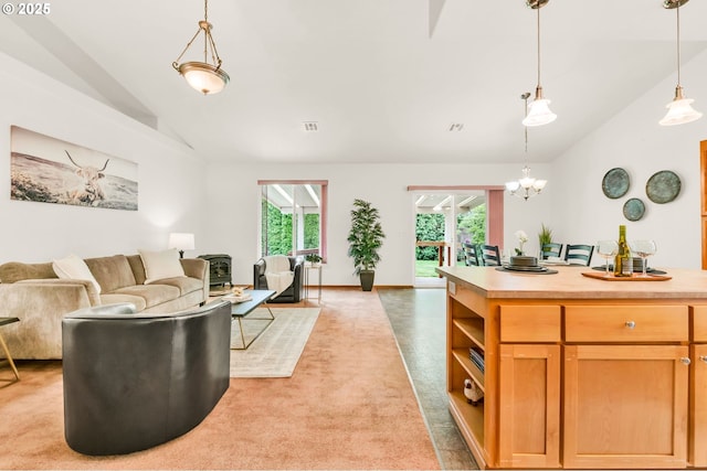living area with baseboards, visible vents, high vaulted ceiling, and light colored carpet