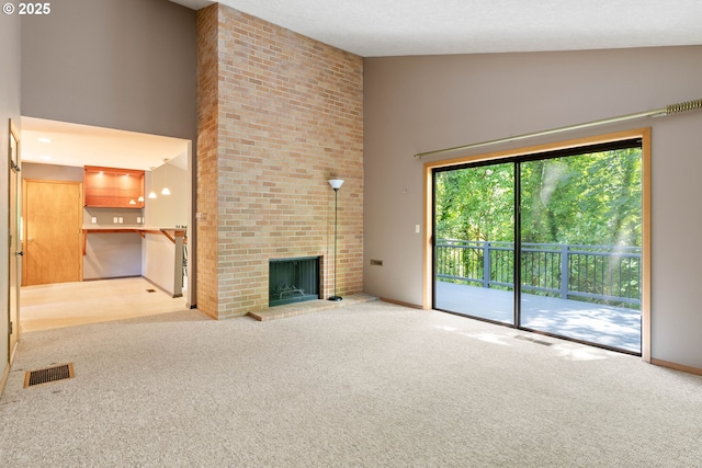 4740 SW Lowell Ct, Portland, OR 97221 - unfurnished living room with high vaulted ceiling, carpet floors, and a fireplace