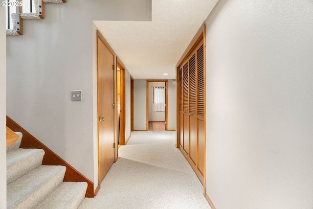 4740 SW Lowell Ct, Portland, OR 97221 - hallway featuring light colored carpet and stairway